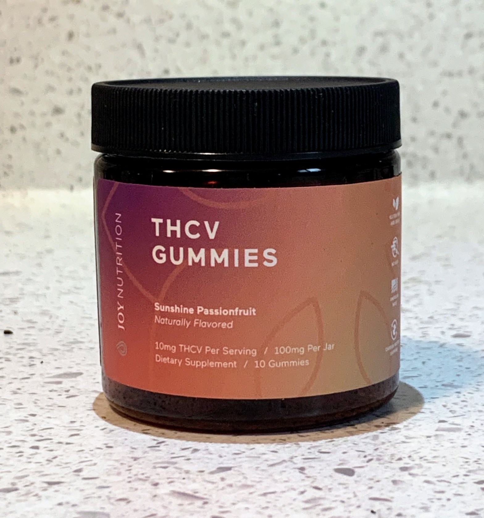 THCV gummies container on white countertop